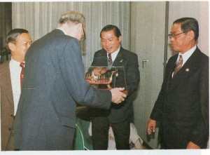 Dr. Suchart Kosolkitiwong presenting a symbol for peace co-operation to Mr. Jean Gaudemet, Counsellor for the Religious Affairs, Ministry for Foreign Affairs, Paris, France. 